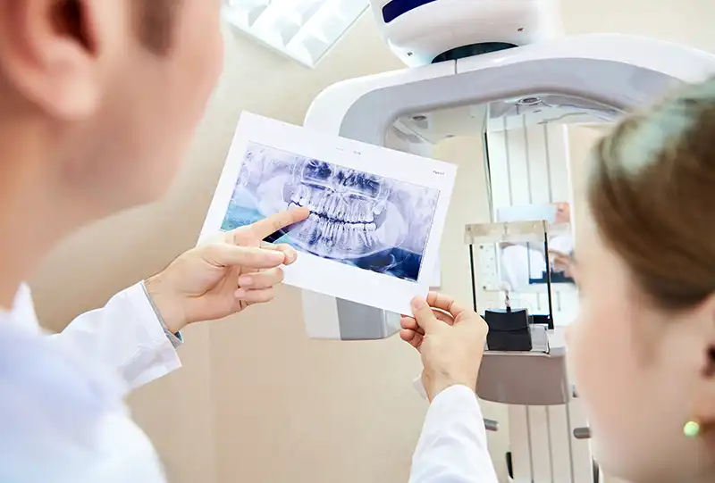 3D cone-beam dental imaging used to plan a tooth extraction and assess root anatomy at Village Dental Olde Raleigh
