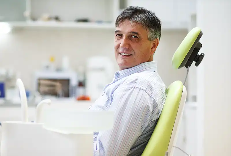 Dental technician fabricating a custom acrylic denture from a digital impression at Village Dental Wake Forest