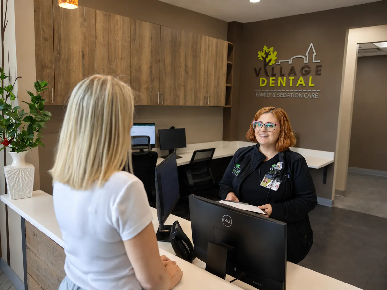 Village Dental — Brier Creek dental team welcoming a patient in the Corners Pkwy office